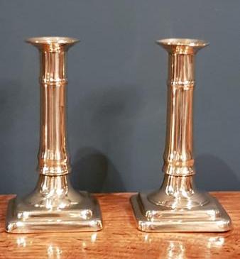 Pair of George III Brass Cannon Pedestal Candlesticks