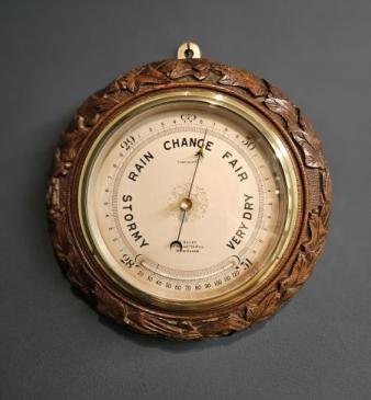 Carved Oak Ships Barometer with Crescent Thermometer