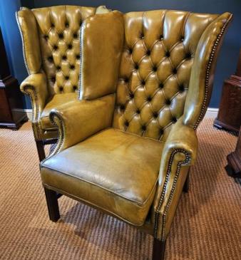 Matching Pair of Leather Wing Back Arm Chairs