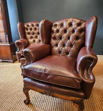 Pair of Carved Walnut Framed Leather Wing Back Arm Chairs