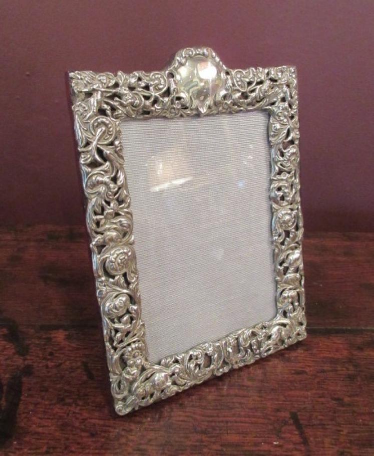 Late Victorian Cherub Decorated Silver Photo Frame - Image 1