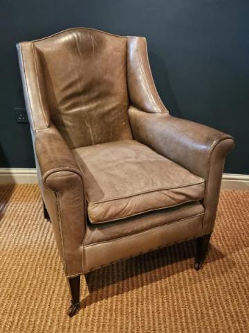 Antique Leather Arm Chair by Warings at Sturmans Antiques furniture for sale